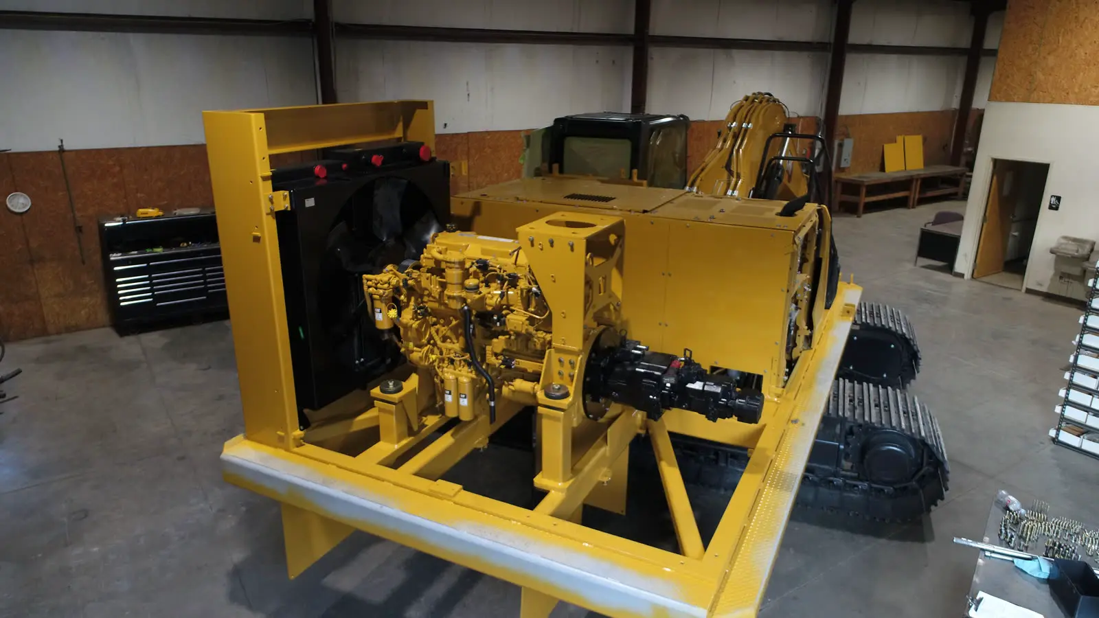 CAT engine and hydraulic pump mounted on a power pack skid during assembly, aerial view
