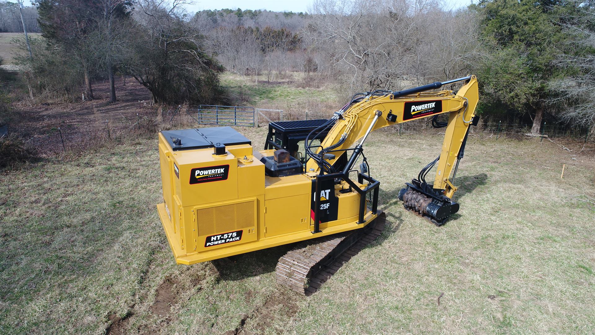 Powertek HT-575 Power Pack on a CAT 325F with mulching head, working in the field
