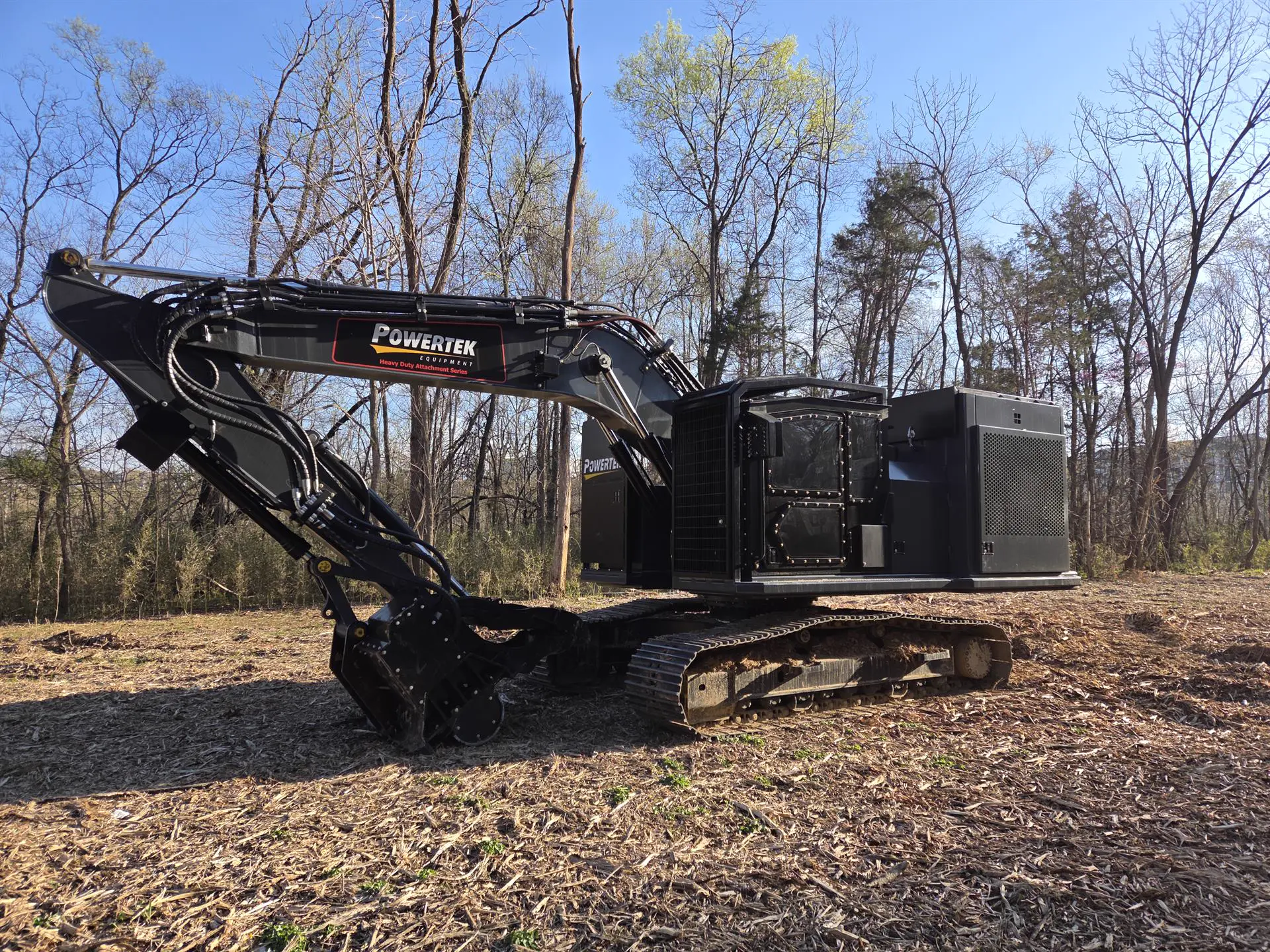 Powertek XPE-200-575 excavator with mulching cutterhead on a cleared land site