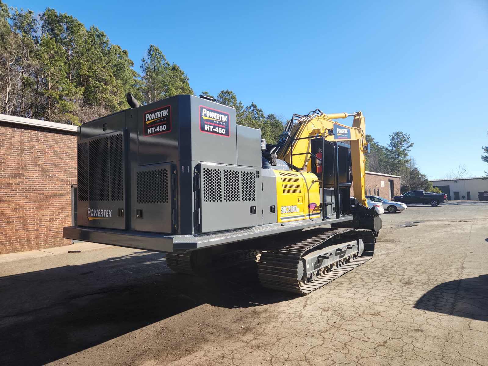 Powertek HT-450 Power Pack in full Powertek branding installed on a Kobelco SK260 excavator