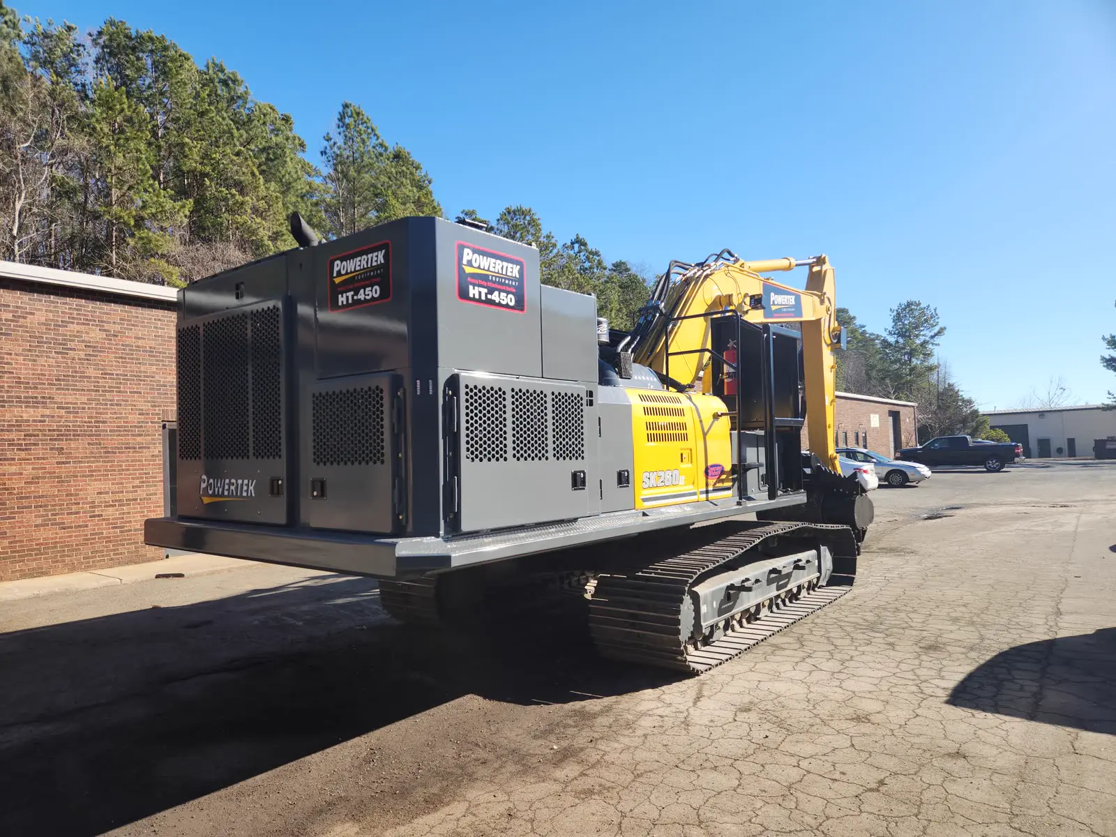 Powertek HT-450 Power Pack in full Powertek branding installed on a Kobelco SK260 excavator