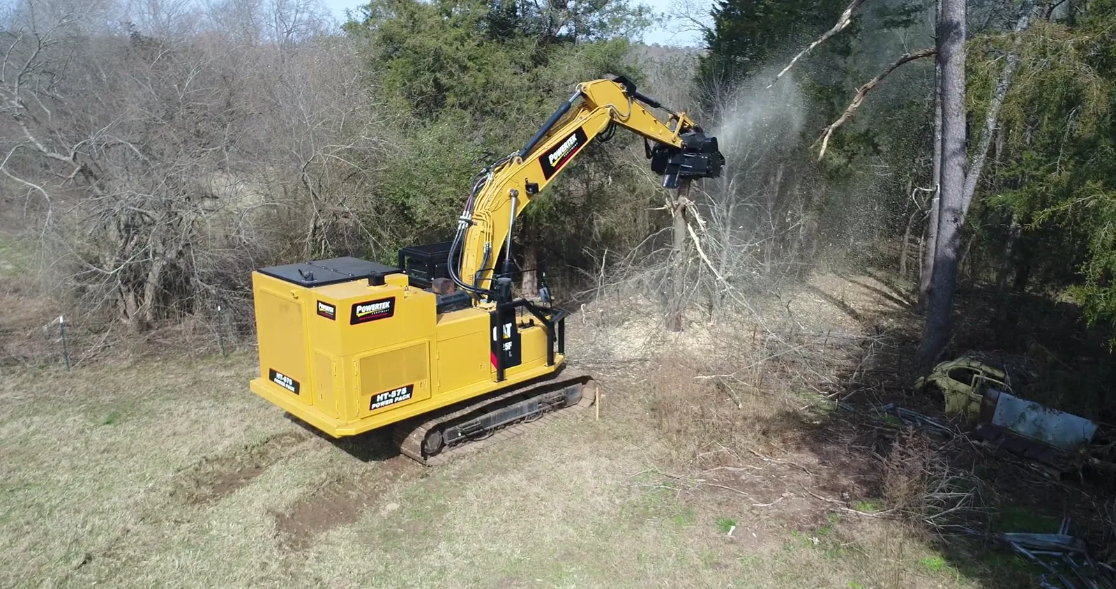 Powertek power pack on an excavator running a mulching head at full rated flow in standing timber