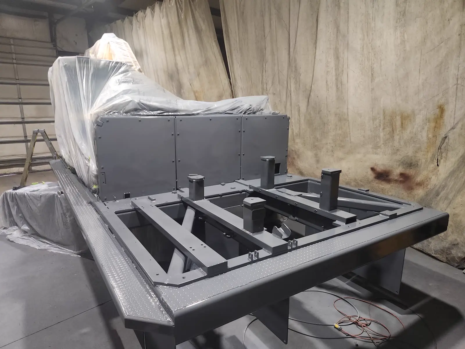 Freshly painted Powertek power pack frame in the paint booth