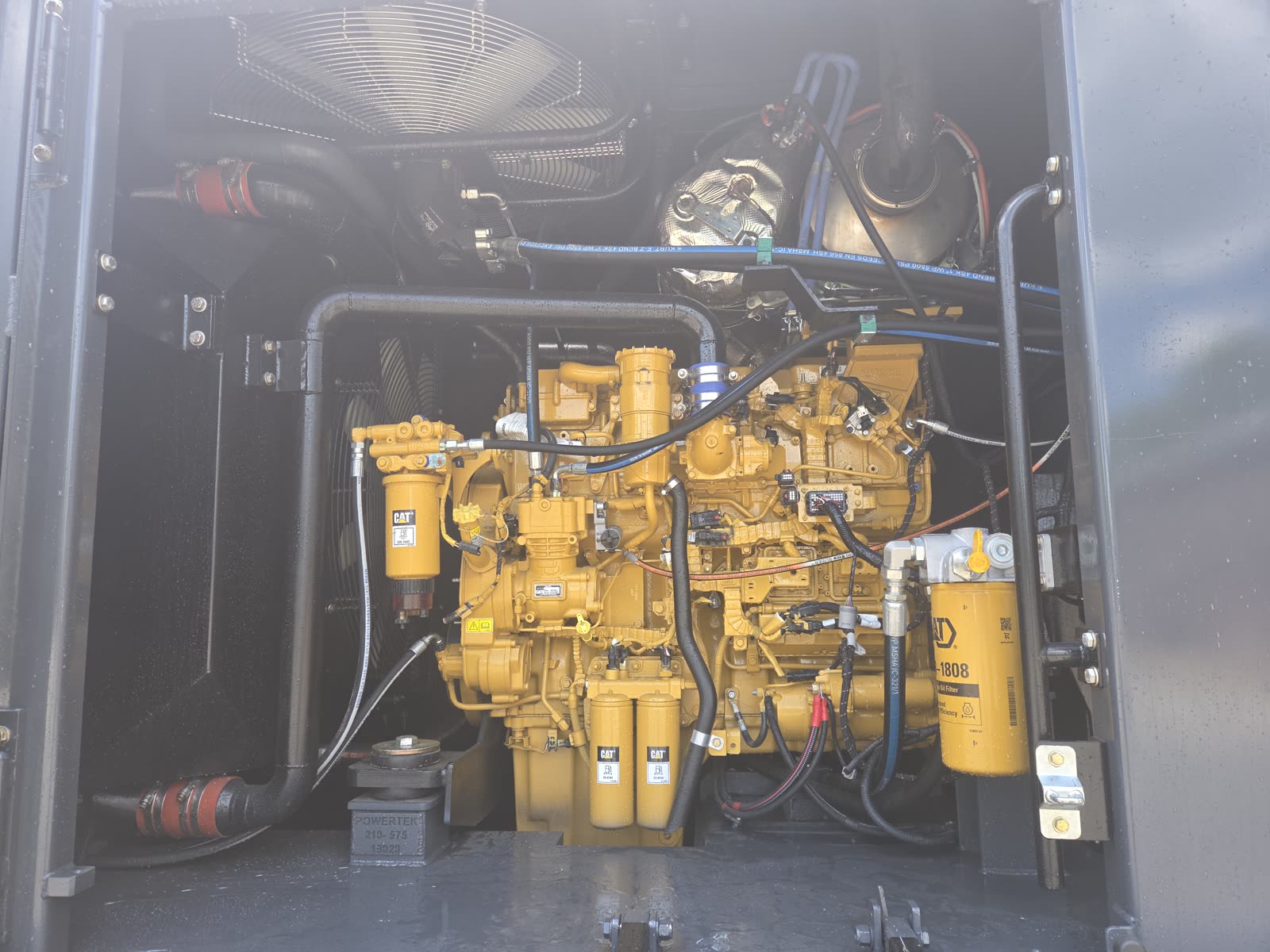 Powertek XPE engine bay open showing CAT engine and clean service access