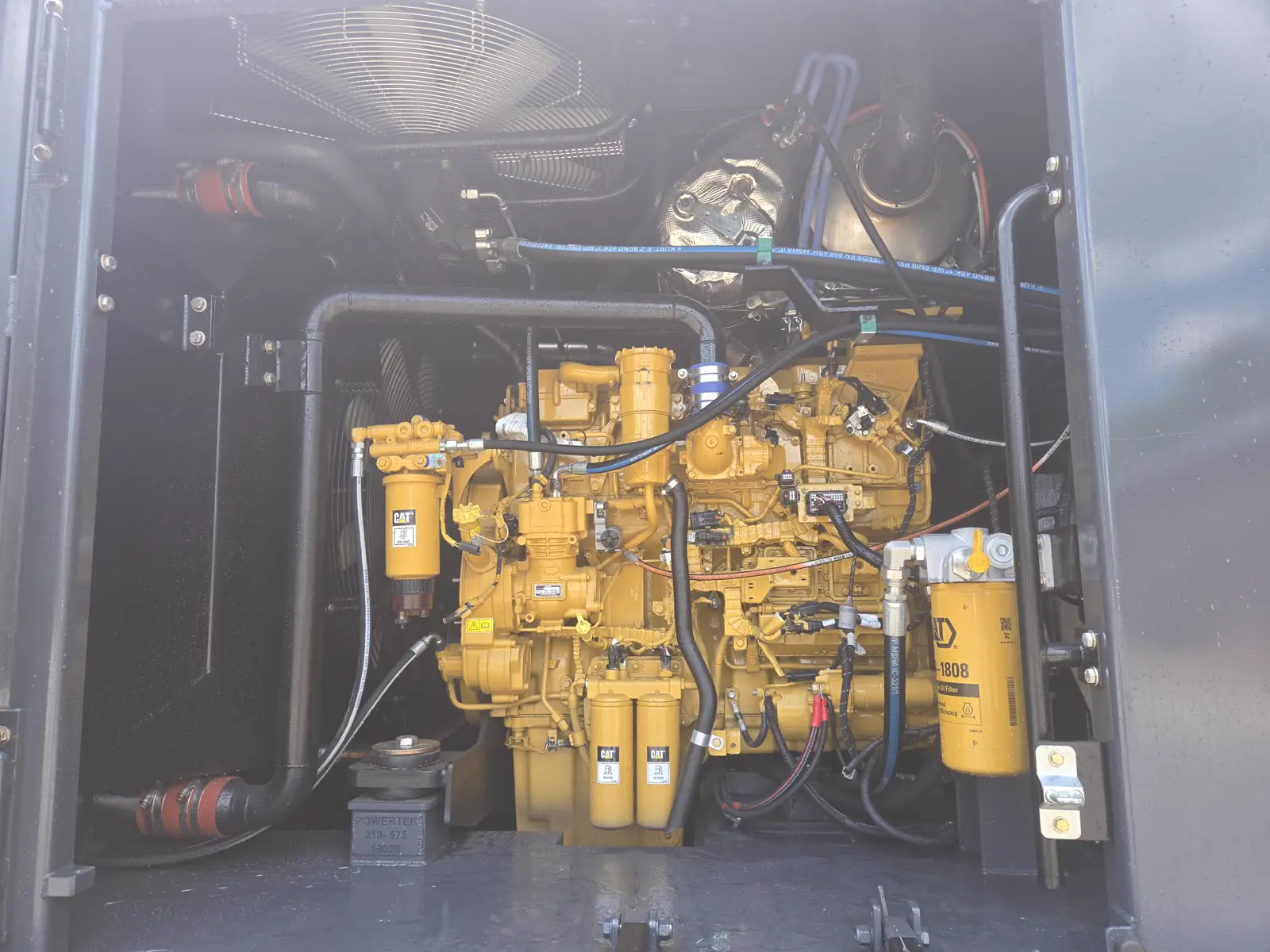 Powertek XPE engine bay open showing CAT engine and clean service access